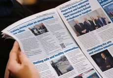 Person reading print version of City Hall Connects newsletter