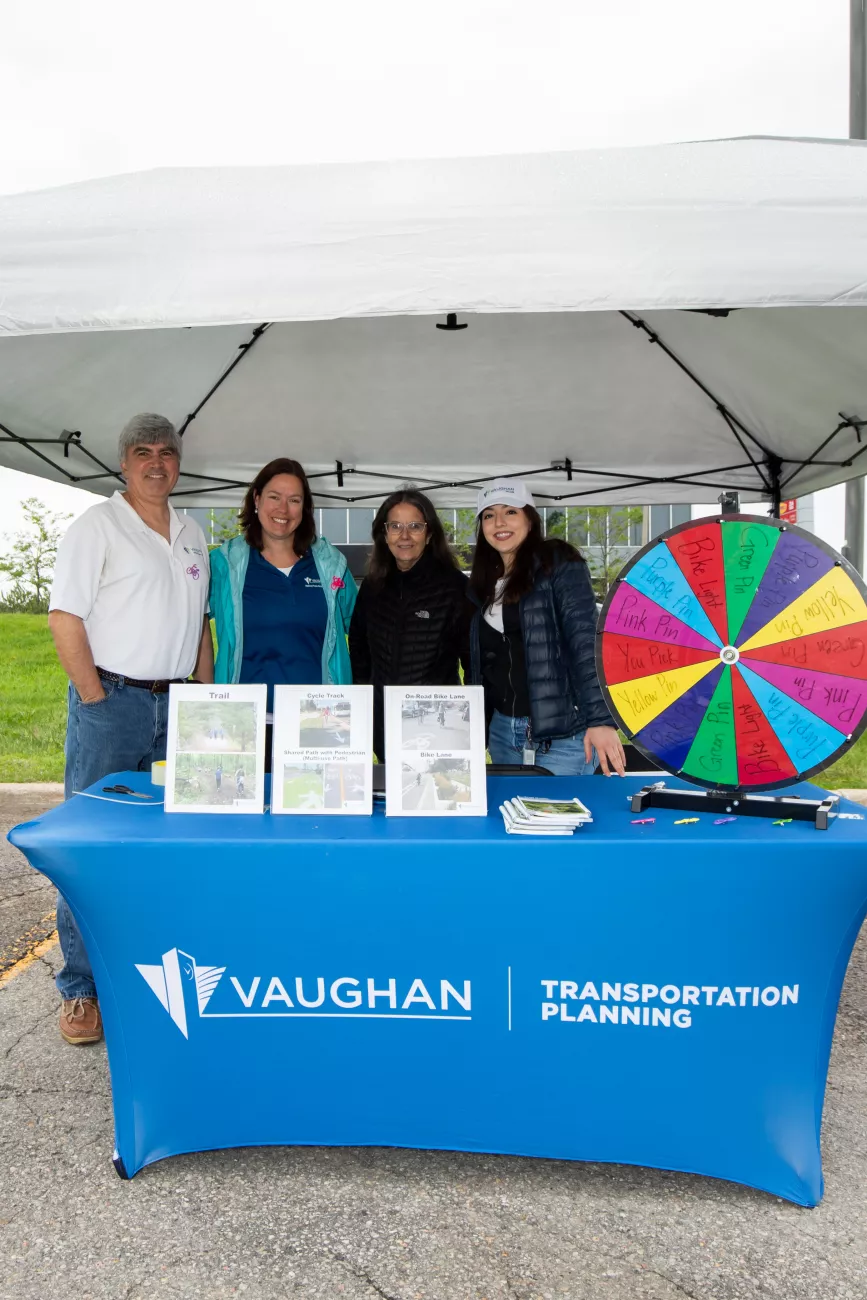 Youth ambassador with City staff at a Public Works Week event.