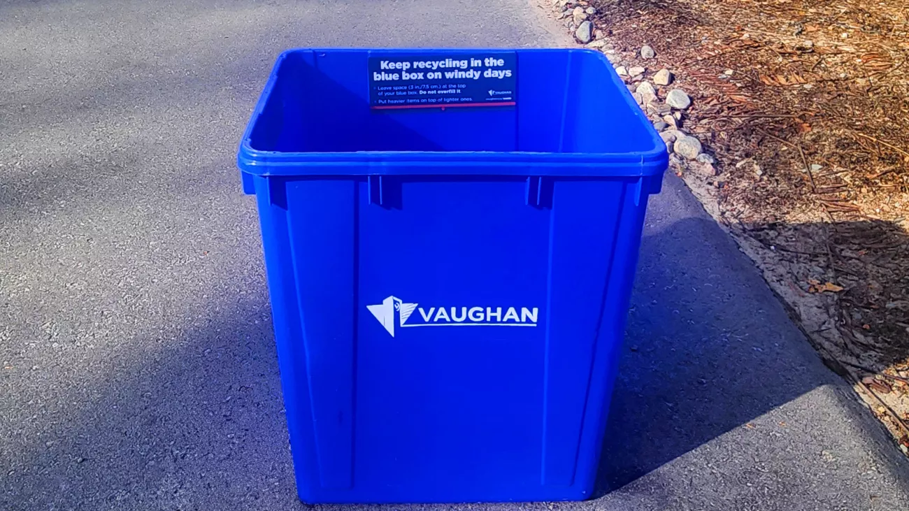 a blue box at the end of a driveway