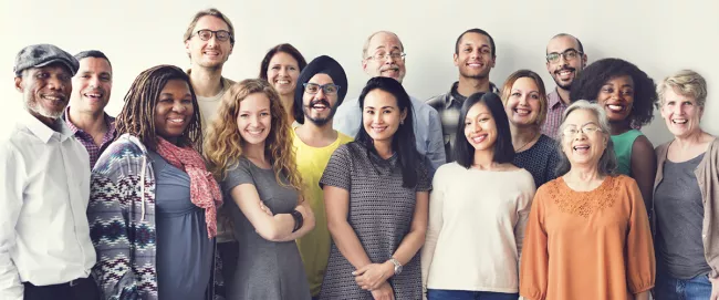 A diverse group of people smiling.