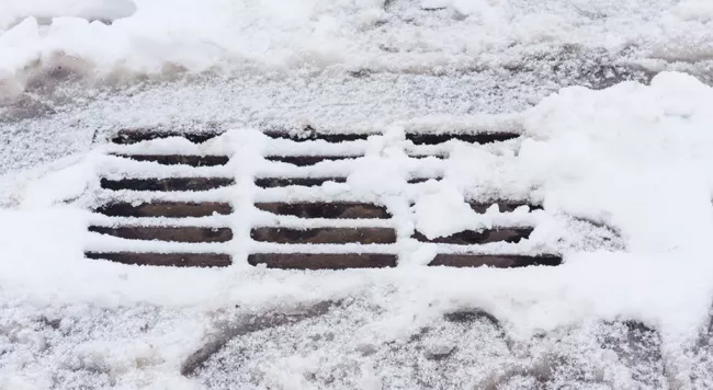 Catch basin covered with snow