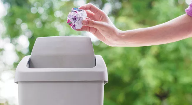 A person throwing garbage out