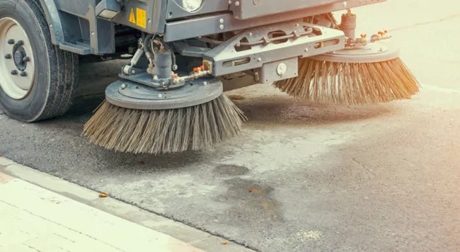 Street sweeping machine at work