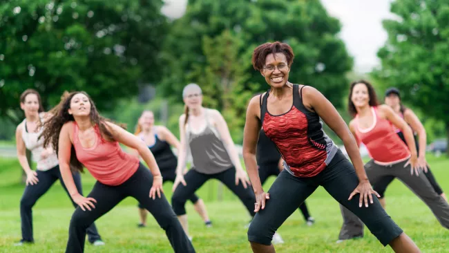 Group of people doing Zumba in a park