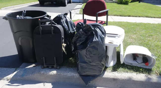 garbage bags, a chair and a toilet