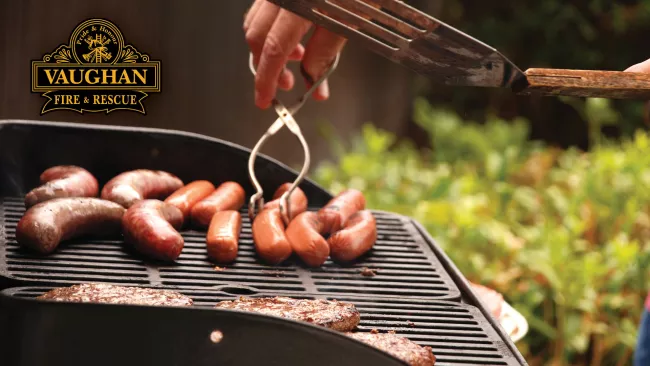 Person grilling meat on the barbecue