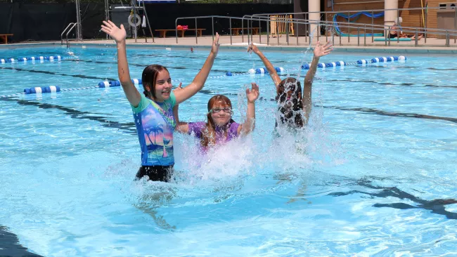 Kids in an outdoor pool