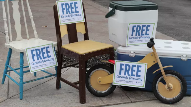 chairs, a tricycle and coolers