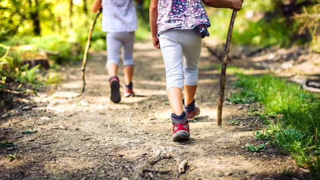 Two people hiking on a trail