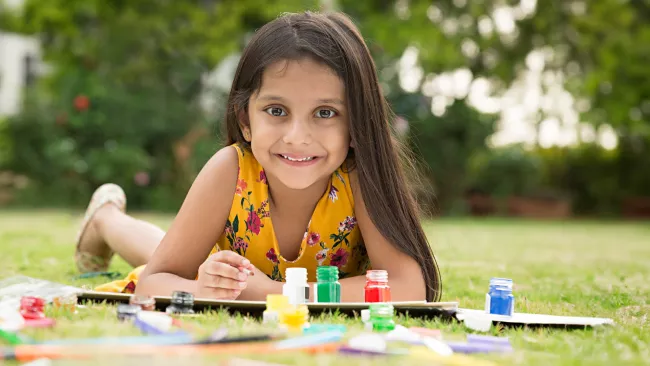 a girl painting outside