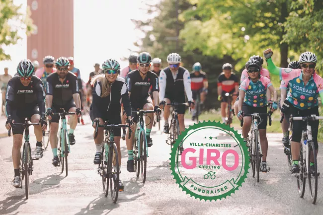 Group of cyclist riding down the road