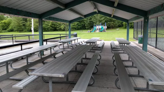 picnic tables under a gazebo in a City park