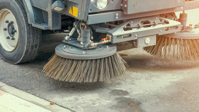 street sweeper out on the road. 