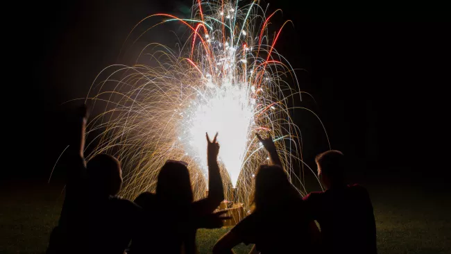 People outside enjoying fireworks