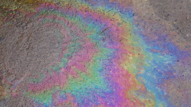 a coloured substance spilled on pavement