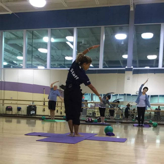 A fitness instructor teaching a class.