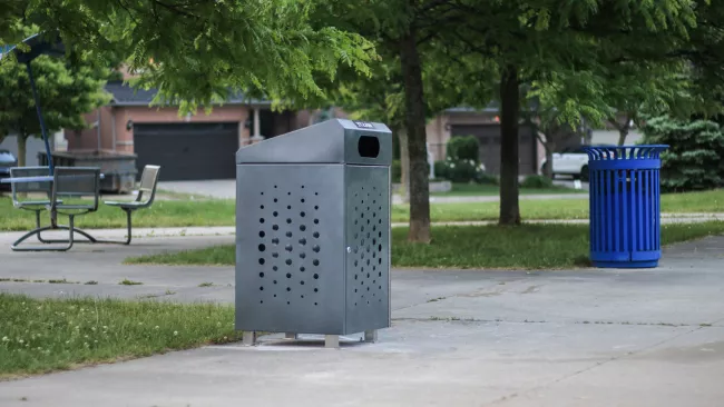 A garbage bin in a City park