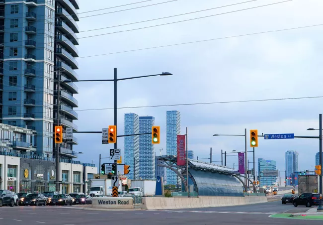 A street with traffic lights and buildings