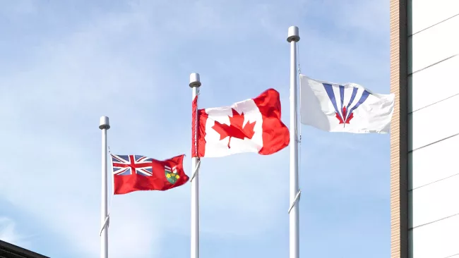 Canadian, Ontario and Vaughan flags flying at City Hall