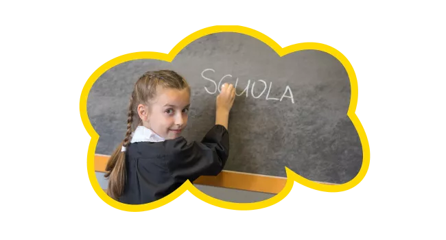 Girl writing Italian on a chalkboard