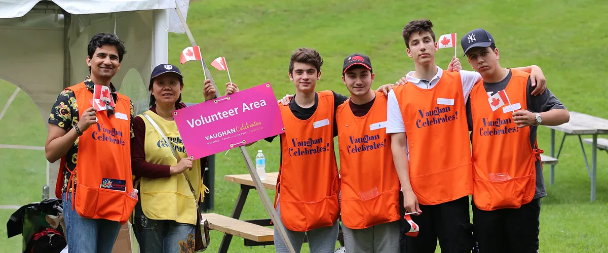 A group of volunteers posing for a picture.
