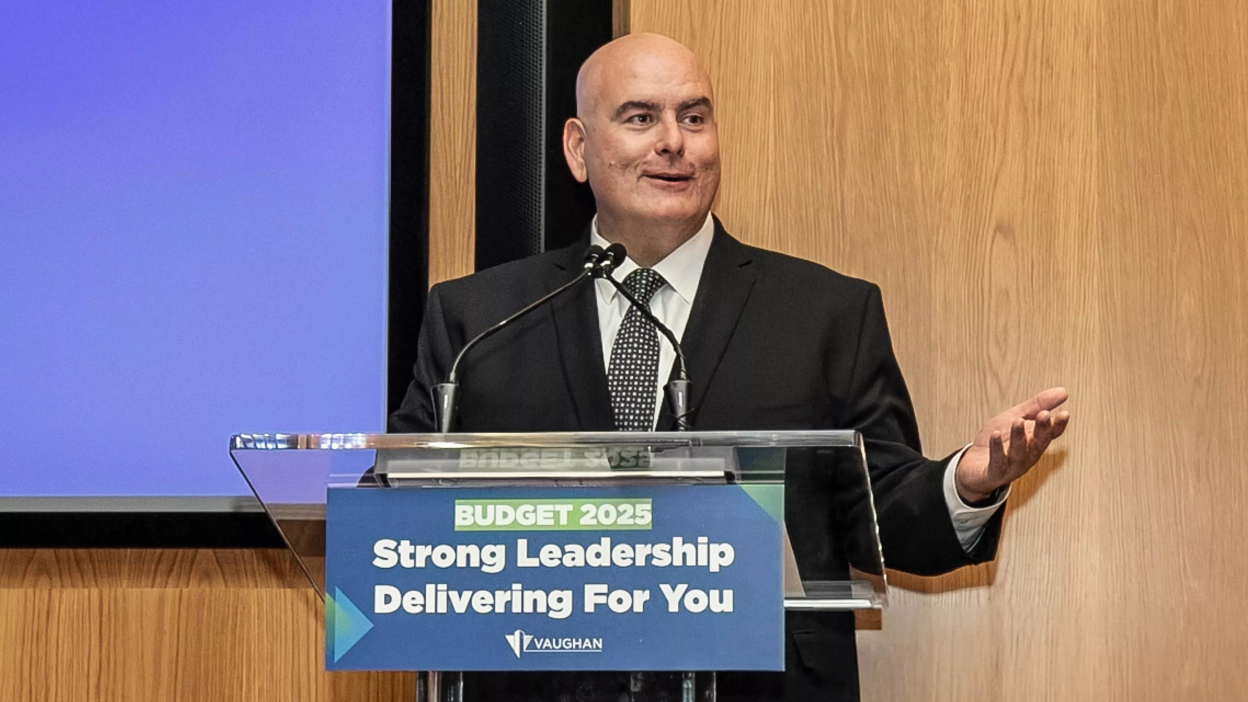 Mayor Del Duca speaking at a podium in the Council chamber