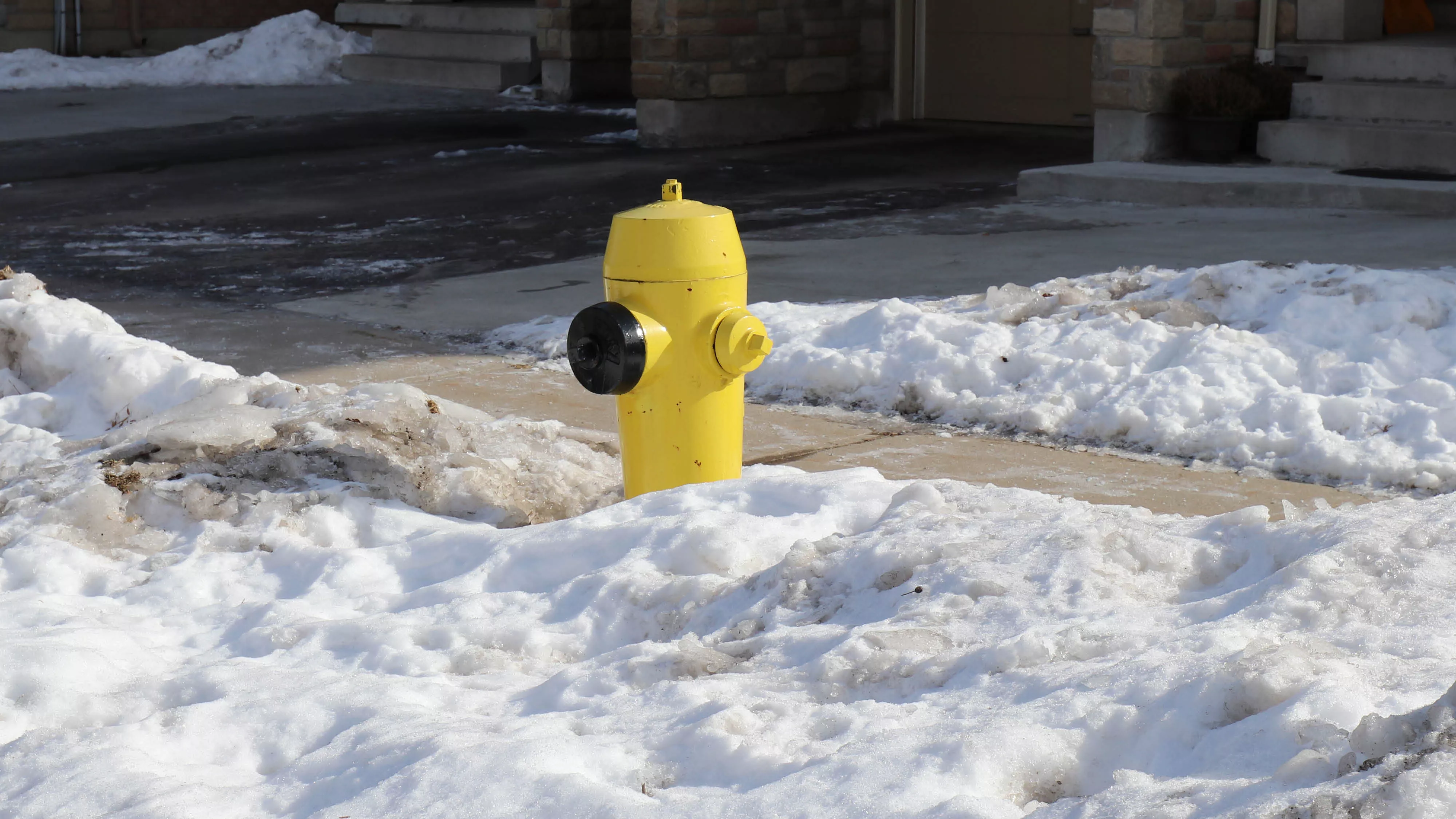 a fire hydrant with snow around it